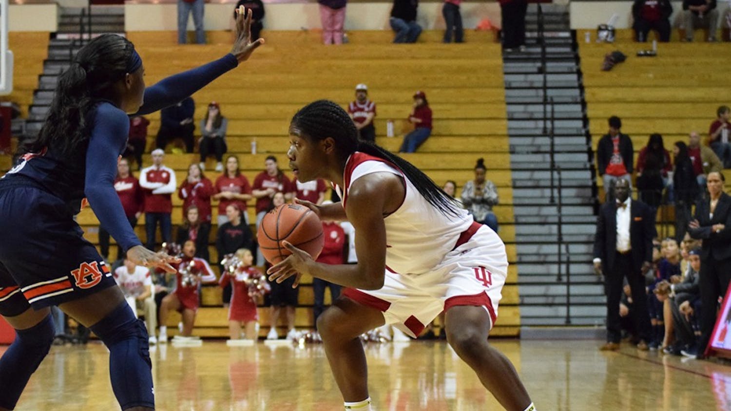 Freshman guard Bendu Yeaney looks for a chance to pass the ball to one of her teammates near the end of the game against Auburn on Sunday. IU lost, 65-53, at Simon Skjodt Assembly Hall.