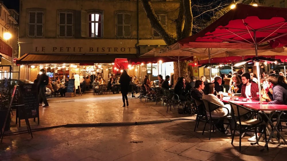 The outdoor cafe Le Petit Bistrot is in full swing March 28 in the Place des Ausgistines in Aix-en-Provence, France.