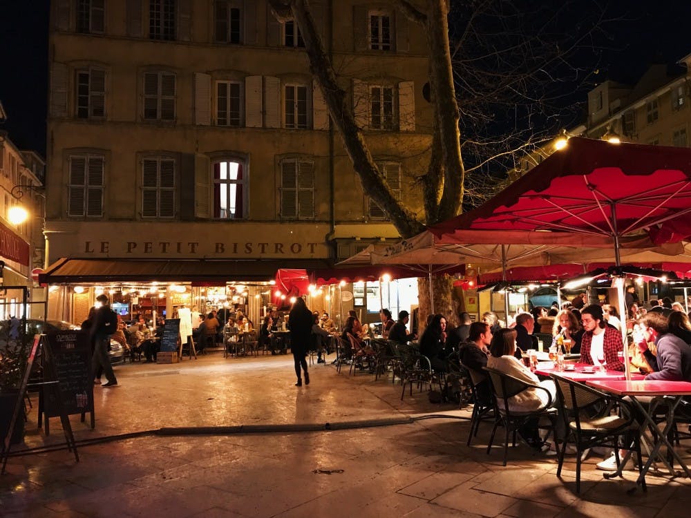 The outdoor cafe Le Petit Bistrot is in full swing March 28 in the Place des Ausgistines in Aix-en-Provence, France.