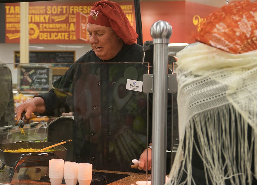 Chef Darren Lewis cooks Spanish food during Kroger's "Taste of Spain" on Thursday evening at the Korger located on College Mall Rd. 
