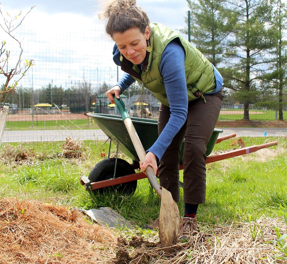 Amy Roche works on Apr. 2 in the Bloomington Community Orchard. As the Outreach leader, Roche educates other community groups with similar projects.