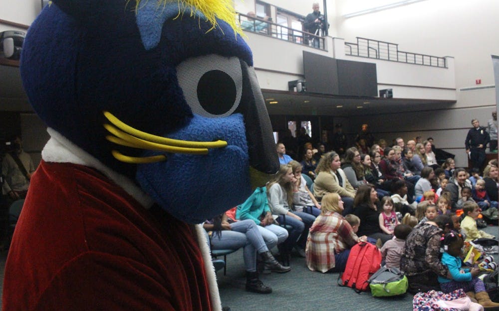 Indiana Pacers' mascot, Boomer the Panther, looks on at city hall as the Pacers hand out presents hand out presents to Bloomigton children. This event took place at 2:30 p.m. on Dec. 7.