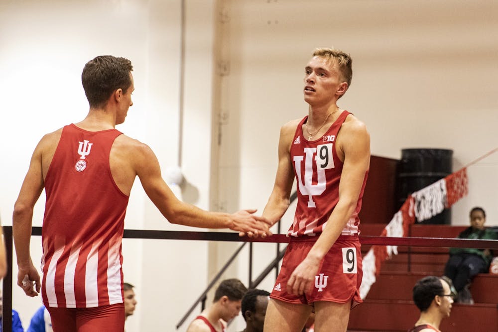 <p>Then-junior distance runner Ben Veatch is congratulated by a teammate after a race Feb. 14, 2020, in Gladstein Fieldhouse. The IU men&#x27;s and women&#x27;s cross country teams competed in the Big Ten Championships on Saturday at the Blue River Cross Country Course in Shelbyville, Indiana.</p>