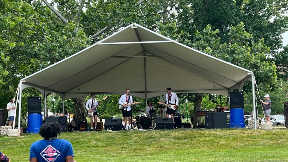 Dressed like lawyers, Class Action performs punk rock songs at RealFest on June 25, 2022, in Dunn Meadow. The festival featured different artists that played a variety of musical genres.