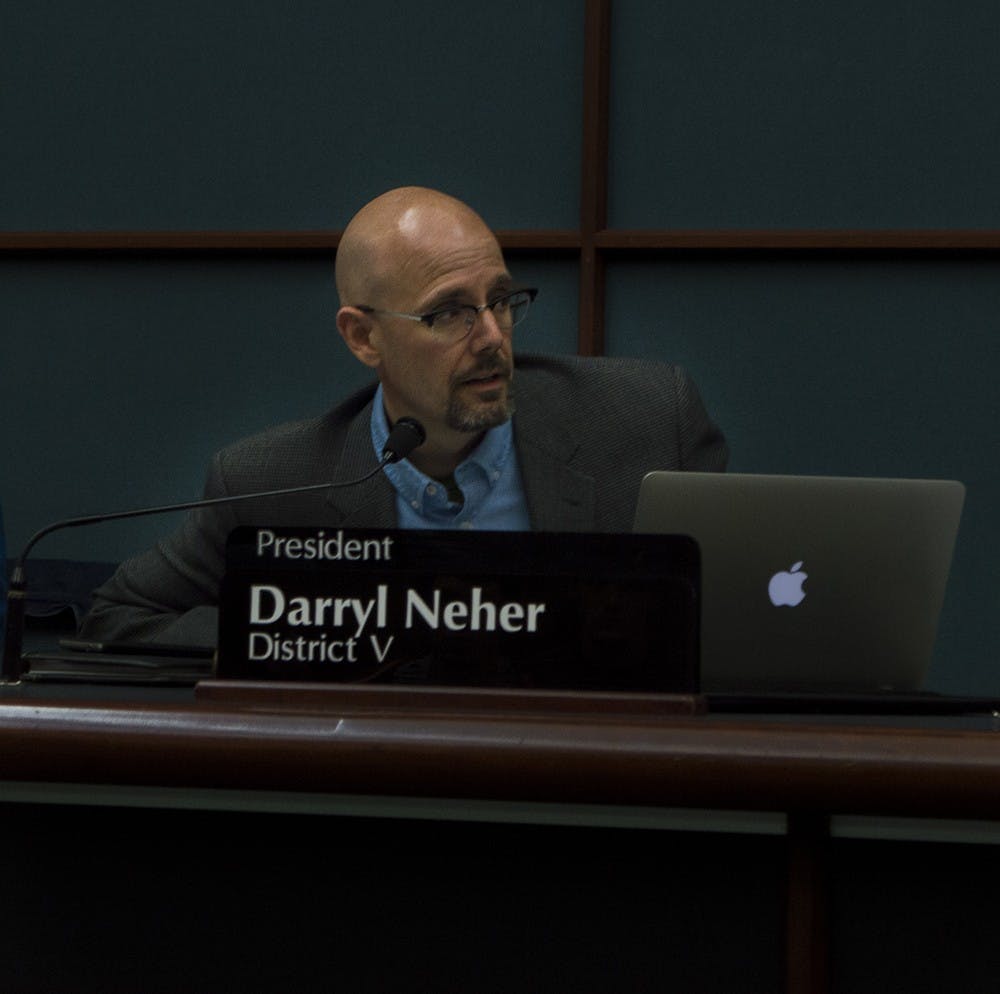 Darryl Neher, the Council President and District V representative, presides over a vote to set wages for firefighters and police officers at the City Council Meeting at City Hall Wednesday.