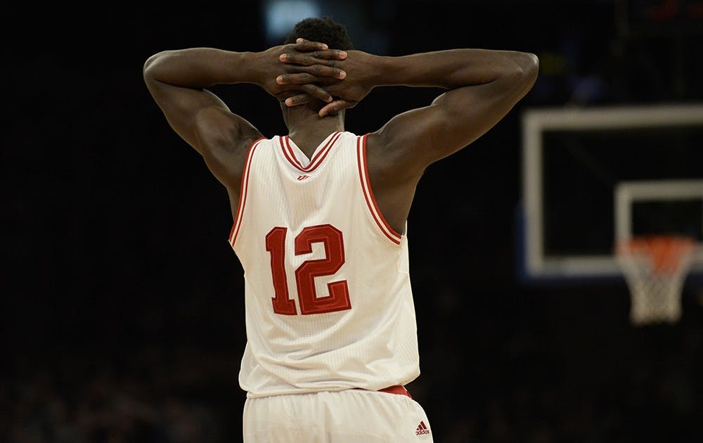 Junior Hanner Mosquera-Perea holds his head after being called for a foul in the second half of IU's game against Georgetown on Saturday at Madison Square Garden in New York City.