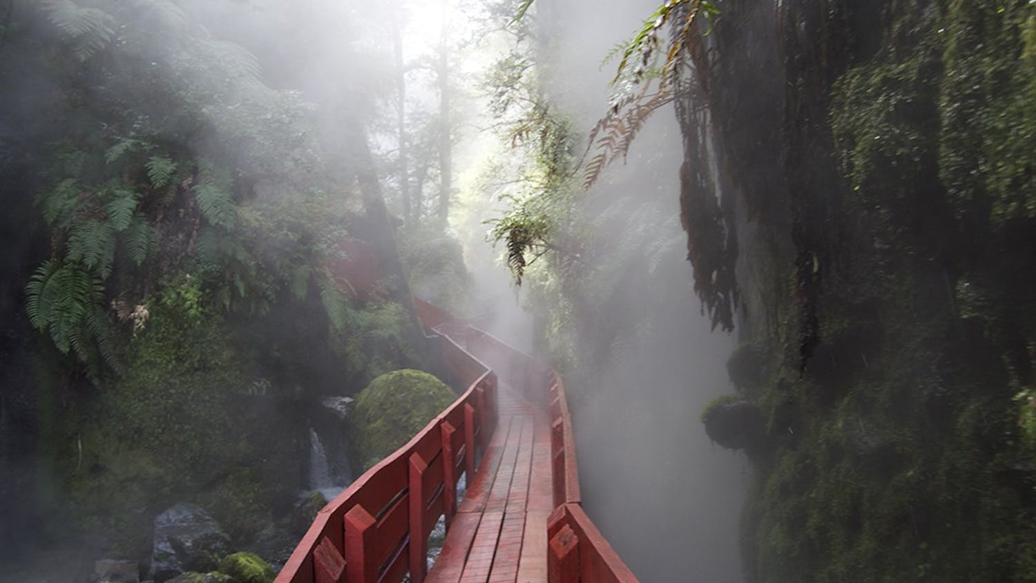  A red, wooden walkway leads visitors to the different pools the Hot Springs has to offer, and at the end of the walkway a waterfall greets viewers eyes. Though the pools are hot, the waterfall and small river that run through the area are ice cold.