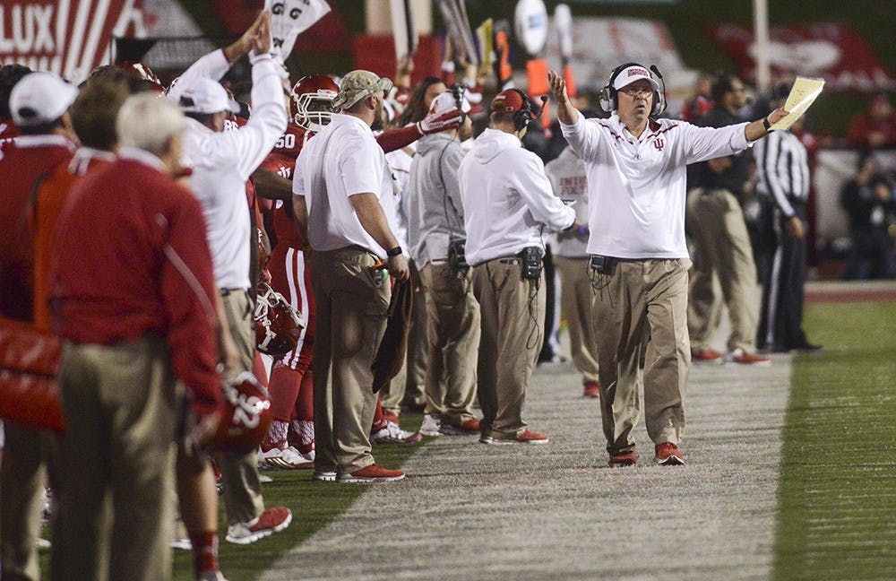Coach Kevin Wilson yells from the sideline during the against Michigan on Saturday at Memorial Stadium. The Hoosiers lost in double overtime, 41-48.