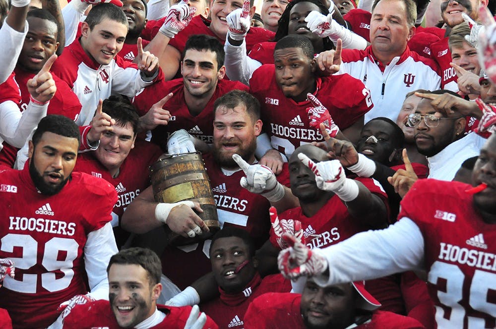 The Hoosiers celebrate their victory against Purdue on Saturday at Memorial Stadium. IU won 26-24 to win the old oaken bucket trophy for the fourth-straight year.
