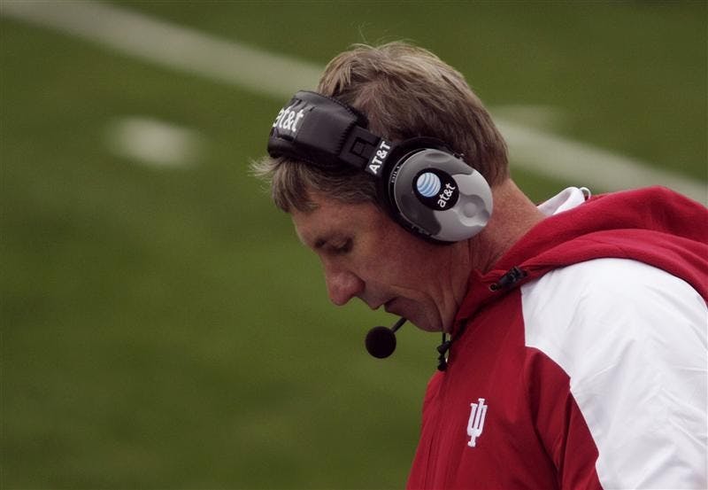 IU coach Bill Lynch calls a play from the sidelines during IU's 55-20 loss to Wisconsin on Saturday at Memorial Stadium. A group of students held up a bed sheet with the words "Fire Bill Lynch" painted on it during the loss.