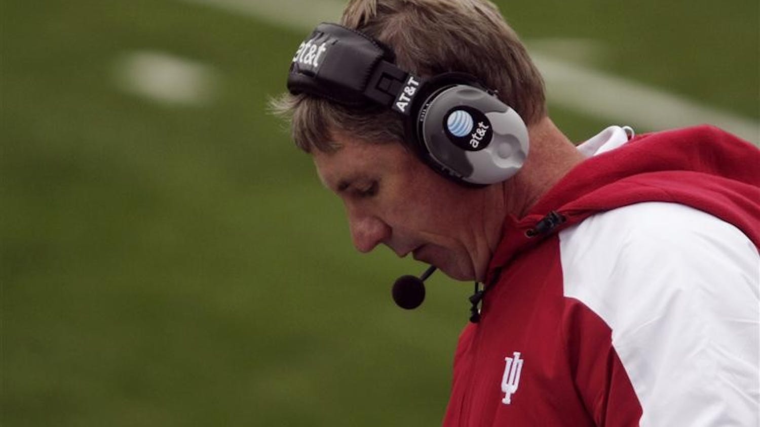 IU coach Bill Lynch calls a play from the sidelines during IU's 55-20 loss to Wisconsin on Saturday at Memorial Stadium. A group of students held up a bed sheet with the words "Fire Bill Lynch" painted on it during the loss.