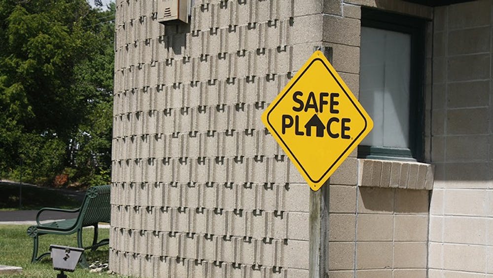 A Safe Place sign is seen outside Bloomington Fire Station 4 on E. Third St. Aug. 22. These signs are markers for buildings that are designated safe places for children in need of immediate help. 