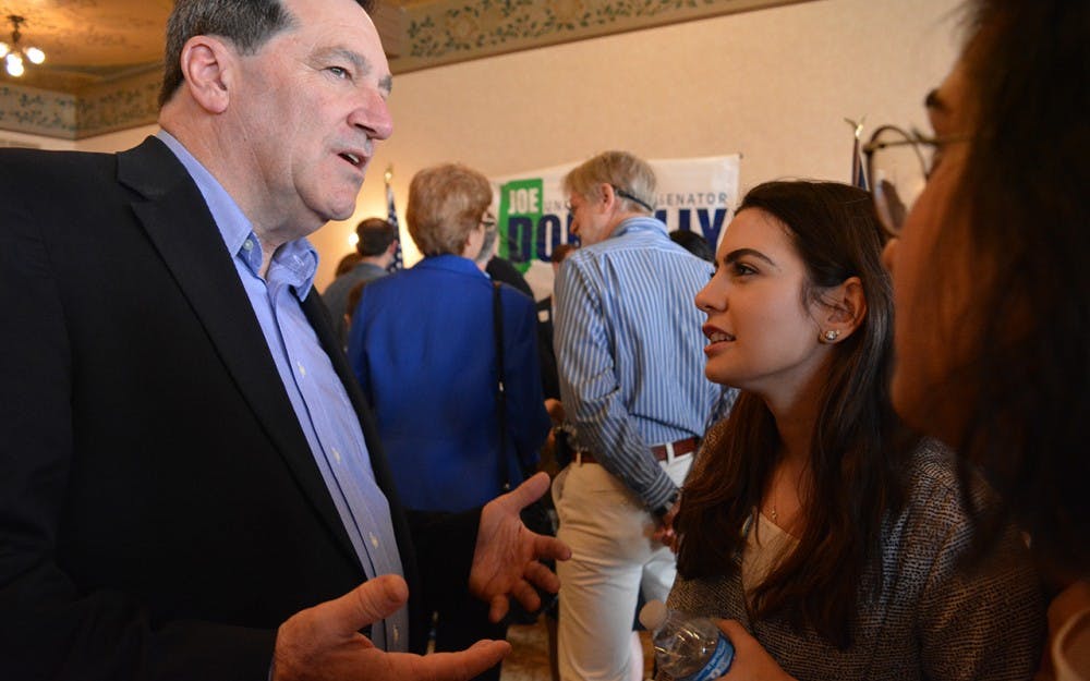 IU senior&nbsp;Dana Khabbaz speaks with Sen. Joe Donnelly, D-Indiana, after his speech. Donnelley came to Bloomington on Saturday to begin fundraising for his 2018 election.