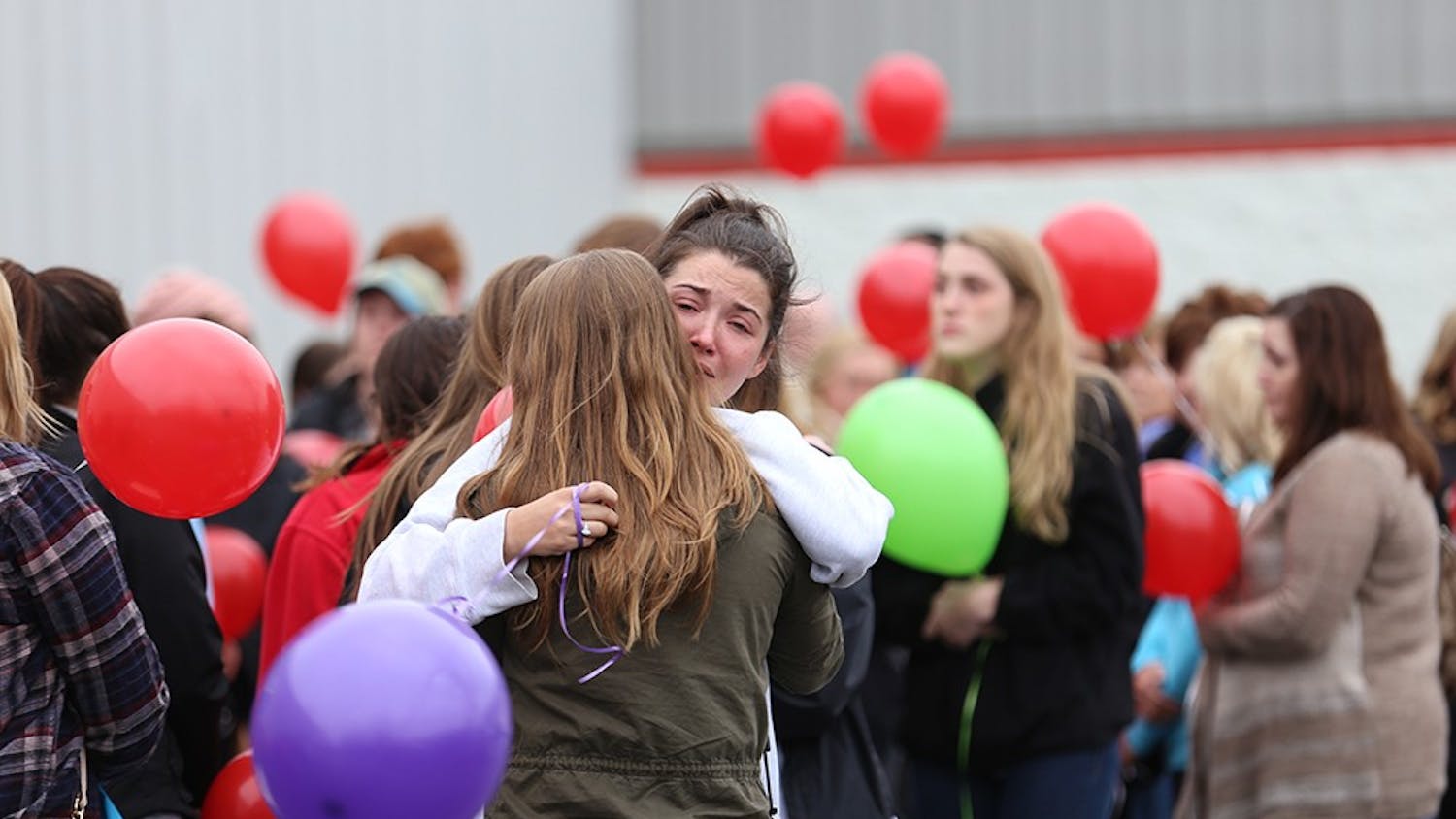 Hundreds gather to mourn the loss of Hannah Wilson, IU senior murdered Friday morning, outside Indiana Elite Cheer & Tumbling in Noblesville, Ind. on Saturday afternoon. Wilson, a Fishers, Ind. native who used to cheer at Indiana Elite, was a psychology major and a sister in the Gamma Phi Beta sorority at IU. 