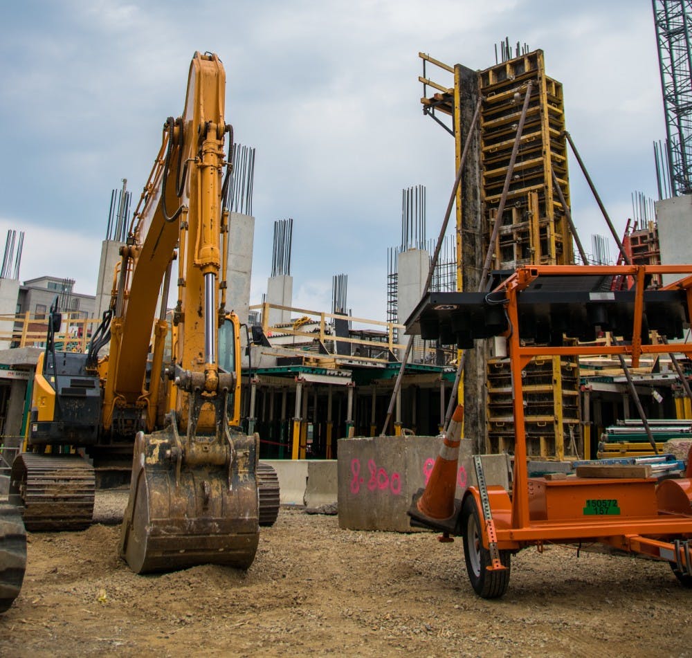 KAREEM OSMAN/PHOTOGRAPHY EDITOR
Construction of a new residential building, to open in 2016, continues on the 3200 St. Paul lot.