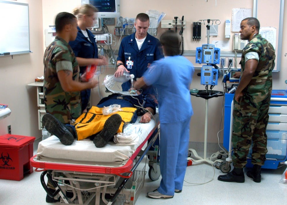 040703-N-9362D-003Guantanamo Bay, Cuba (July 3, 2004) - U.S. Naval Hospital, Guantanamo Bay (Gitmo) staff participates in an emergency room training exercise to ensure immediate and accurate treatment during an actual casualty. U.S. Navy photo by Photographer