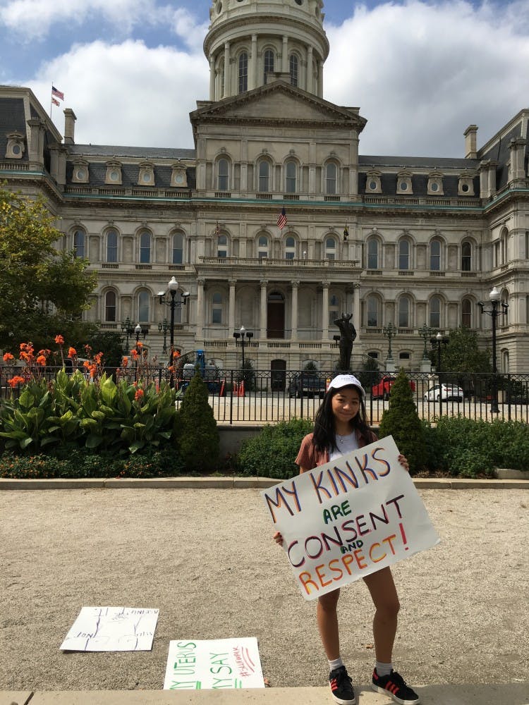 COURTESY OF SAM FOSSUM
Hopkins freshman Clara Liff stands in front of Baltimore’s City Hall.