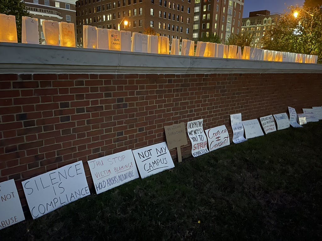 COURTESY OF MOLLY GAHAGEN
Protesters shared messages to the University during the candlelight vigil.