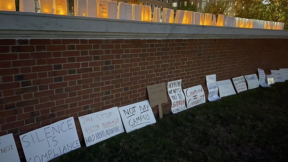 COURTESY OF MOLLY GAHAGEN
Protesters shared messages to the University during the candlelight vigil.