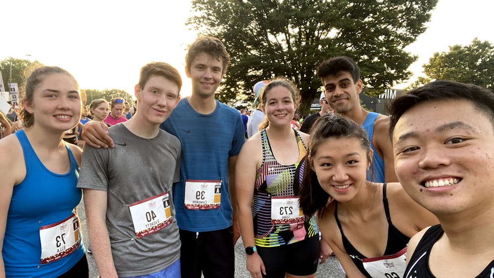 COURTESY OF MINGYUAN SONG
The Running Club at Hopkins gathers at the starting line of the Charles Street 12.