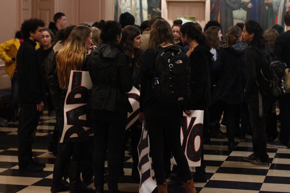  LEON SANTHAKUMAR/Photography Editor
Protesters gathered inside Shriver Hall before Dershowitz spoke.