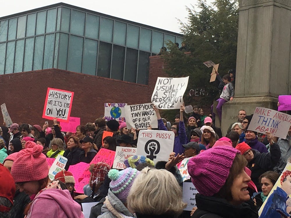 COURTESY OF GILLIAN LELCHUK Protesters gathered with signs at Baltimore’s Women’s March.
