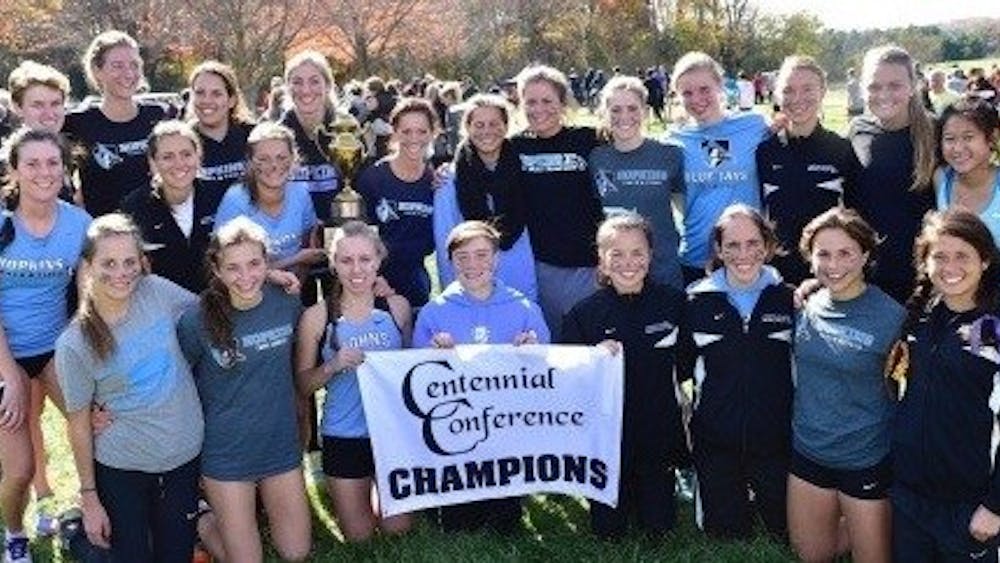  HOPKINSSPORTS.COM
The women’s team celebrates yet another conference championship.