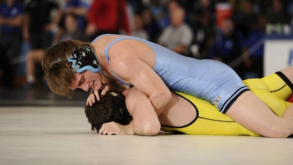 HOPKINSSPORTS.COM
The Jays battle for a ninth place finish at the Doug Parker Invitational.