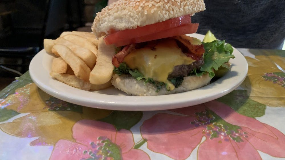 &nbsp;COURTESY OF Jerry Wu
The deliciously decadent bacon cheeseburger with fries served at The Dizz.