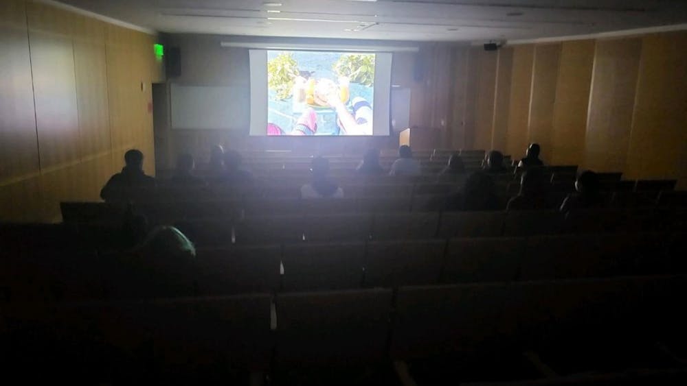 COURTESY OF HELENA GIFFORD
Students watch the short film Jardins Paradise at the Hopkins Film Society’s Whodunnit screening.