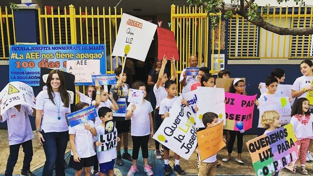 COURTESY OF VERONICA MONTANE
Students rally outside a school in Puerto Rico that has no electricity.