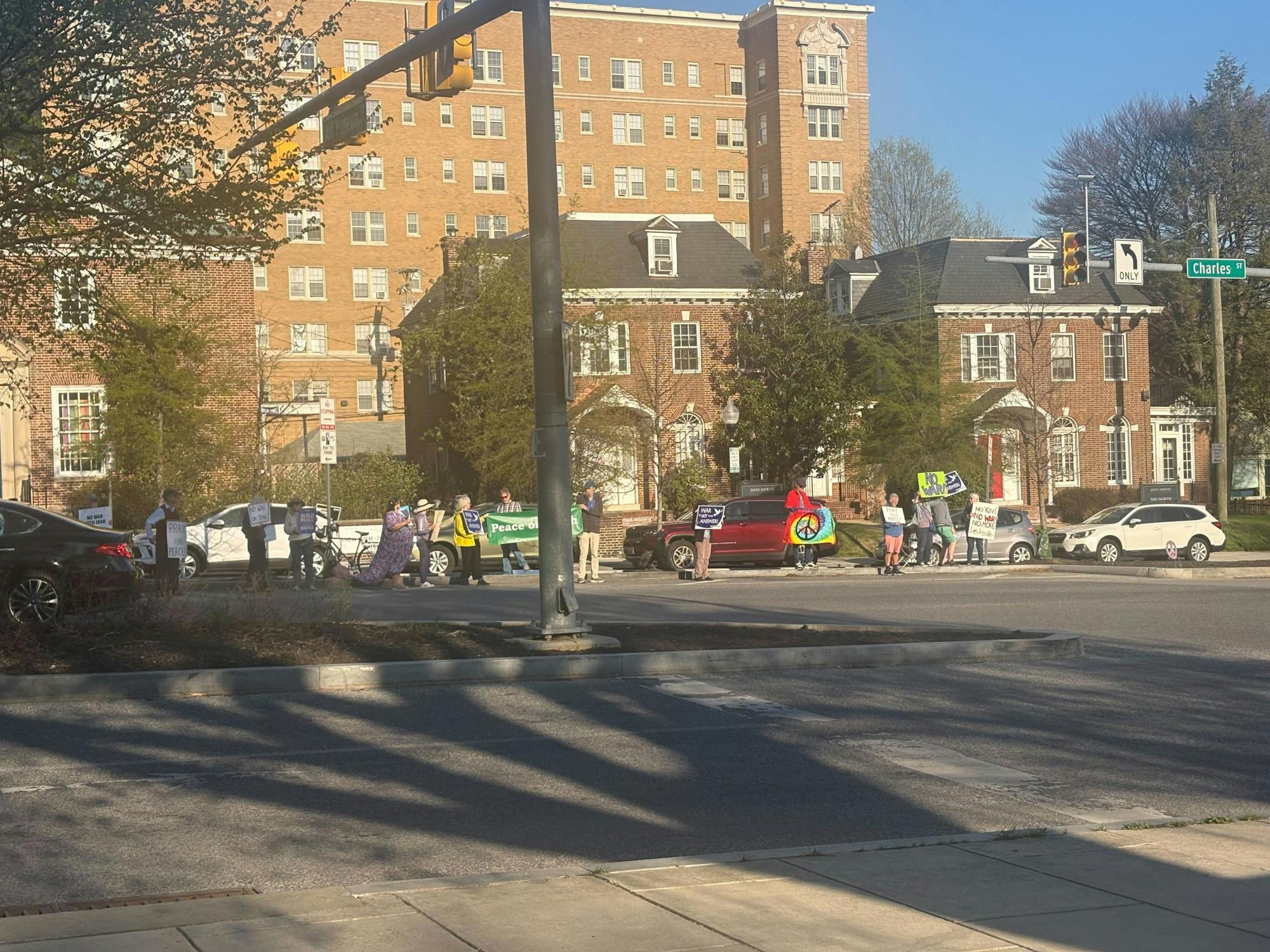 COURTESY OF SHREYA TIWARI
On Friday, April 10 the Homewood Friends gathered on Art Museum Drive and North Charles Street to protest U.S. military involvement in Iran, calling for peace.&nbsp;