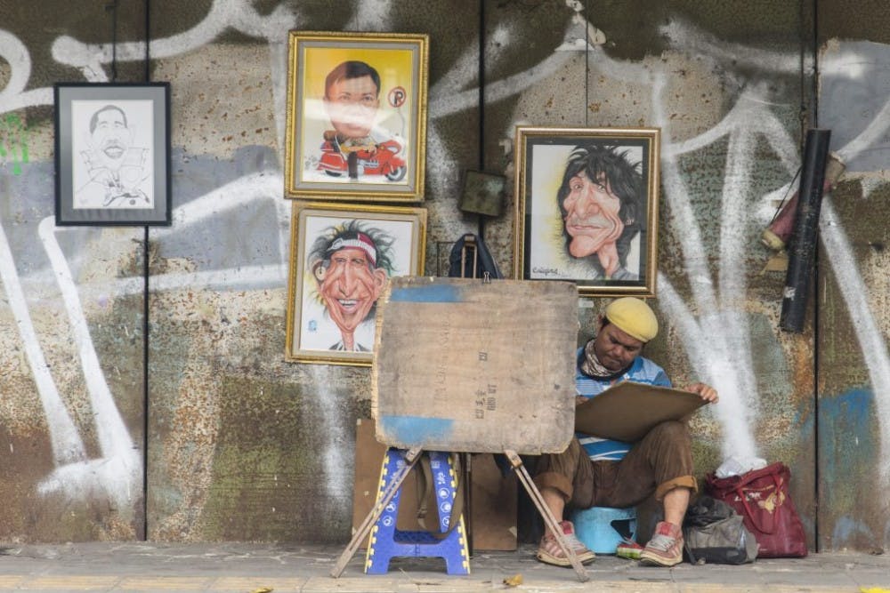  INDIGO SKIES PHOTOGRAPHY/ CC BY-NC-ND 2.0
A street artist paints without trying to impress the world around him. Can this be considered art?