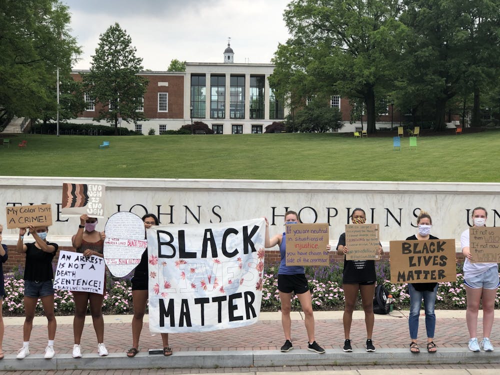 COURTESY OF RUDY MALCOM
Protesters gathered in front of the Hopkins sign on June 5 to demand racial equality.