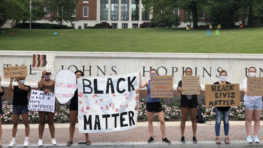COURTESY OF RUDY MALCOM
Protesters gathered in front of the Hopkins sign on June 5 to demand racial equality.