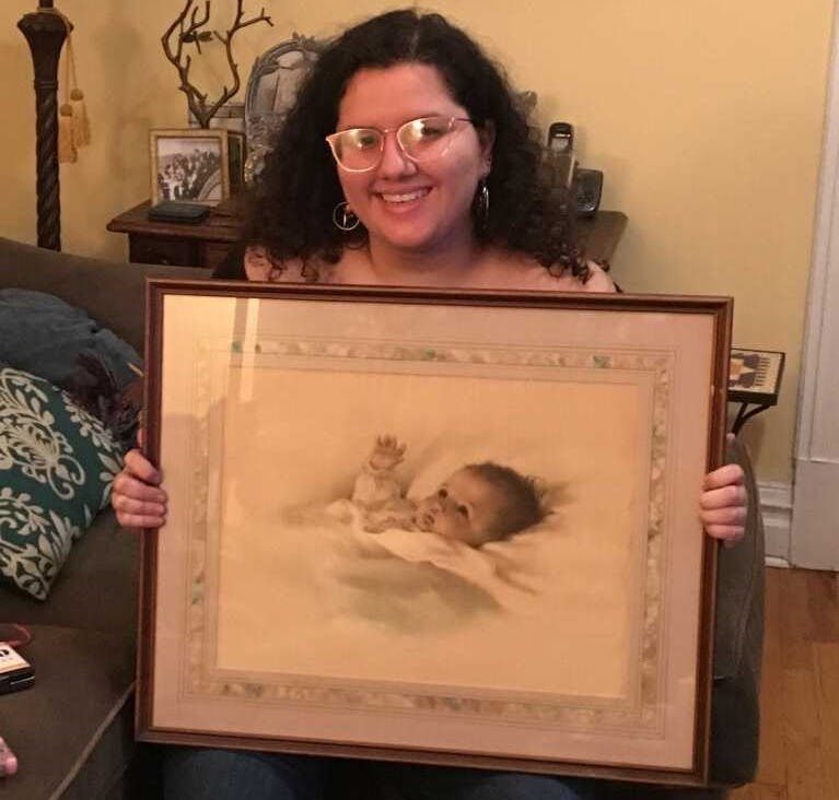 COURTESY OF SOPHIA LOLA
For her 20th birthday, Lola's parents gifted her a painting they originally found when she was just a few months old.