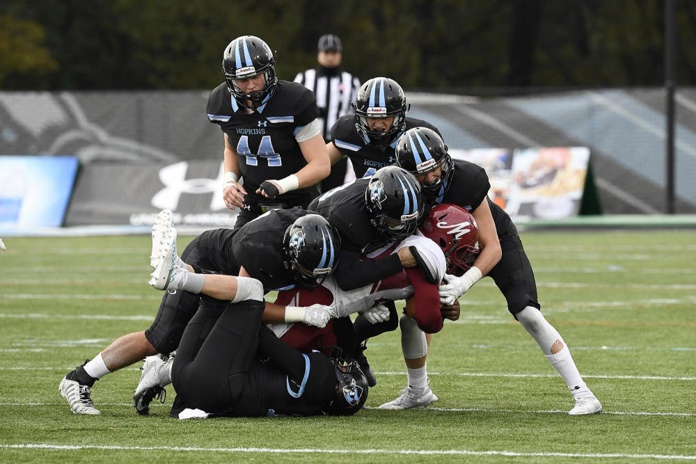 HOPKINSSPORTS.COM
The Hopkins defense forced six turnovers against Muhlenberg.