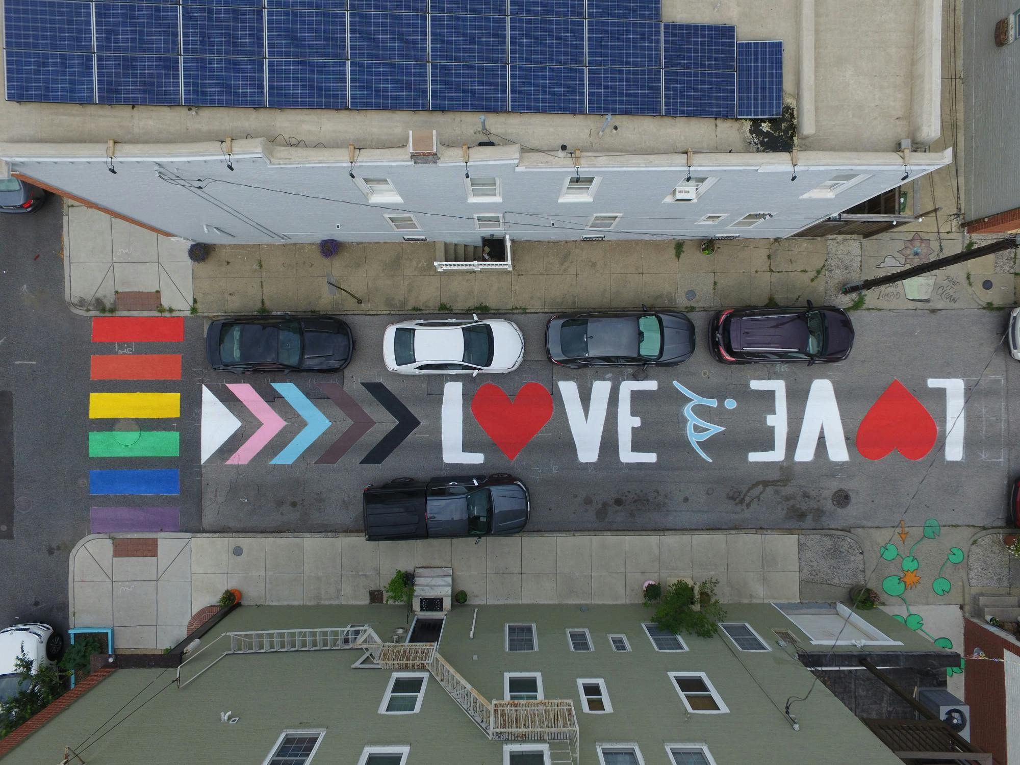 COURTESY OF CHRIS BEALL
The Love is Love street mural adorns North Curly Street in Patterson Park.