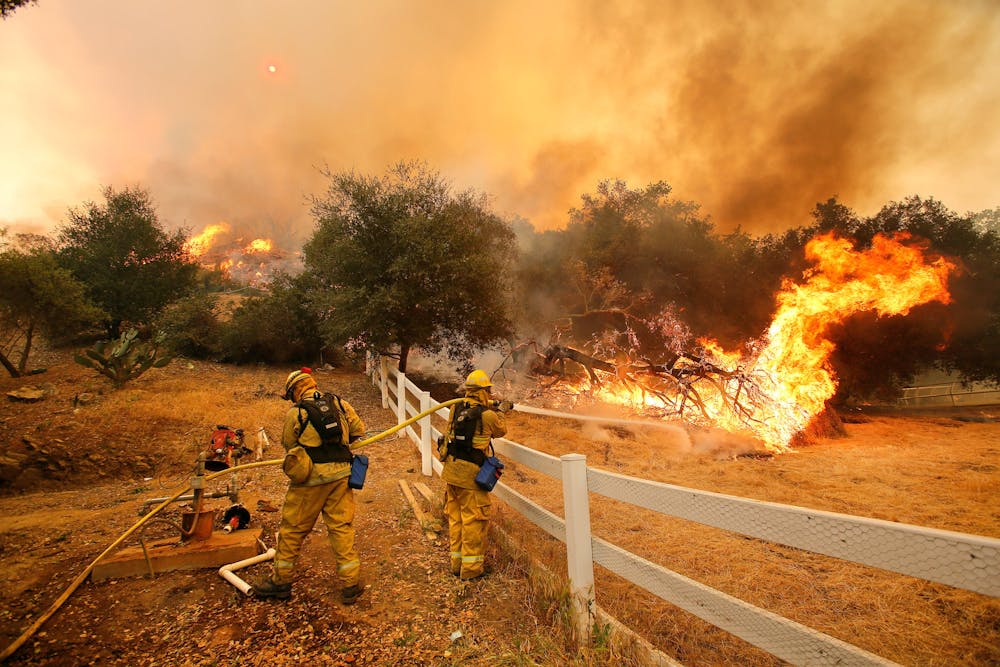 MEL MELCON / CC BY 2.0
Firefighters put out a wildfire in Hidden Valley in 2013.