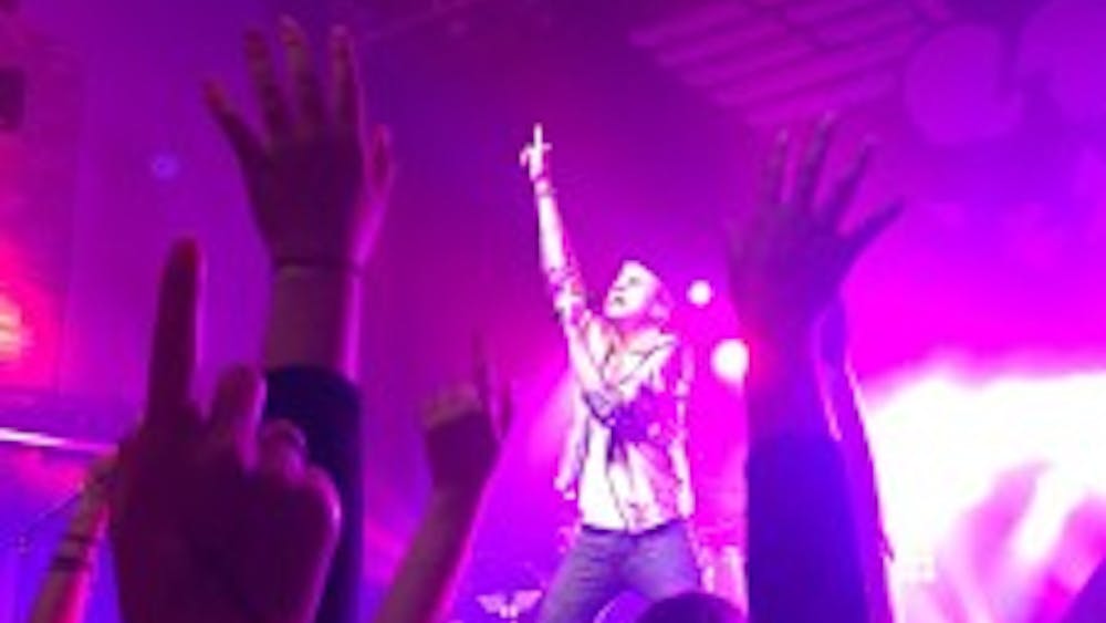  COURTESY OF EMILY HERMAN
 Neon Trees, led by lead singer Tyler Glenn, brought high energy and intense lights to the Rams Head Live! stage on July 18.