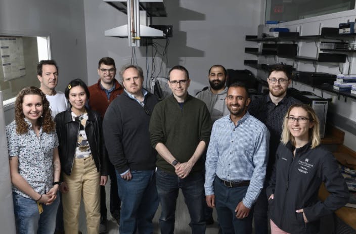 COURTESY OF RAJIV MCCOY
The Hopkins-based team that made contributions to the Human Genome Project poses for a photo.