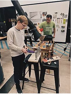 COURTESY OF THE NEW NORM
Team members of The New Norm use materials science to give red Solo cups a new life as fabric.