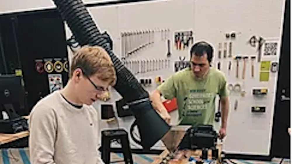 COURTESY OF THE NEW NORM
Team members of The New Norm use materials science to give red Solo cups a new life as fabric.