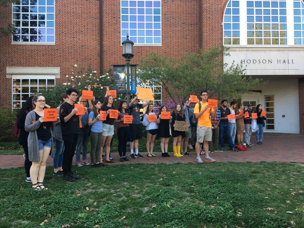 COURTESY OF MORGAN OME
Members of Refuel Our Future, the student-led fossil fuel divestment campaign, staged a demonstration before the forum began.