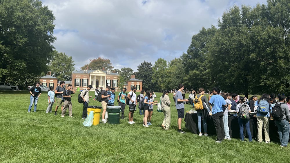 COURTESY OF BERNADETTE KIM
Student line up at the Beach to register to vote and fill forms for absentee ballots. 