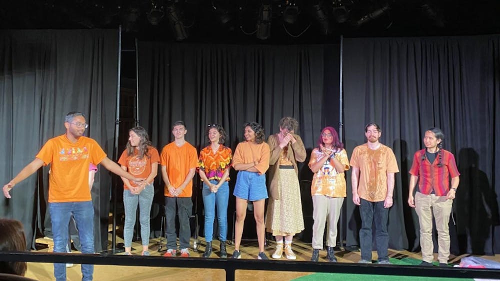 COURTESY OF VARSHNI VEERAVIGNESH
The Buttered Niblets gather onstage during the improv comedy show.