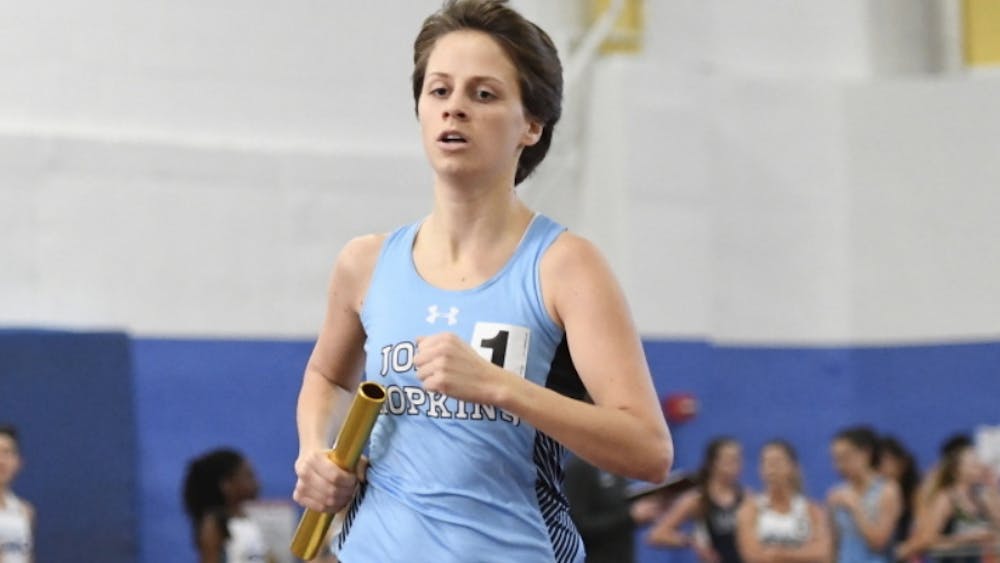HOPKINSSPORTS.COM
Felicia Koerner wins the 3k at the Tufts Last Chance Meet to qualify for NCAAs.