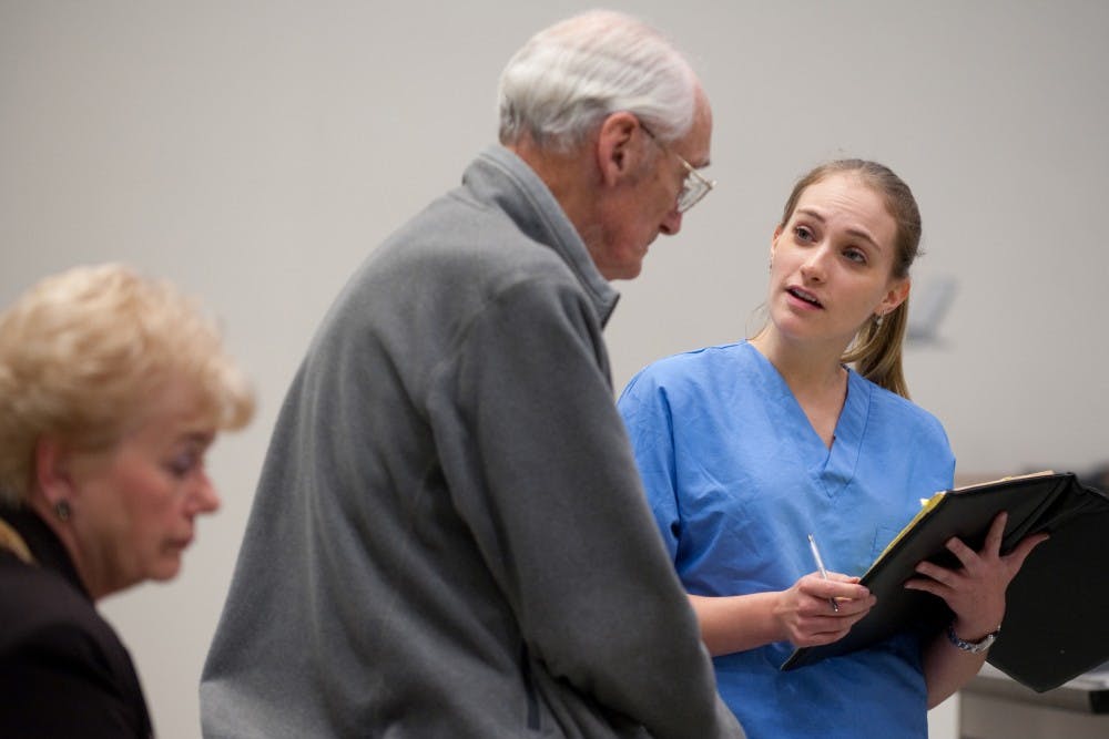 Judy Jones, Stu Erickson and Katrina Klein (from left) enact a scene from the play. "We hope the students learn that how they communicate with patients can determine the outcome," says UCI geriatrician Dr. Lisa Gibbs.