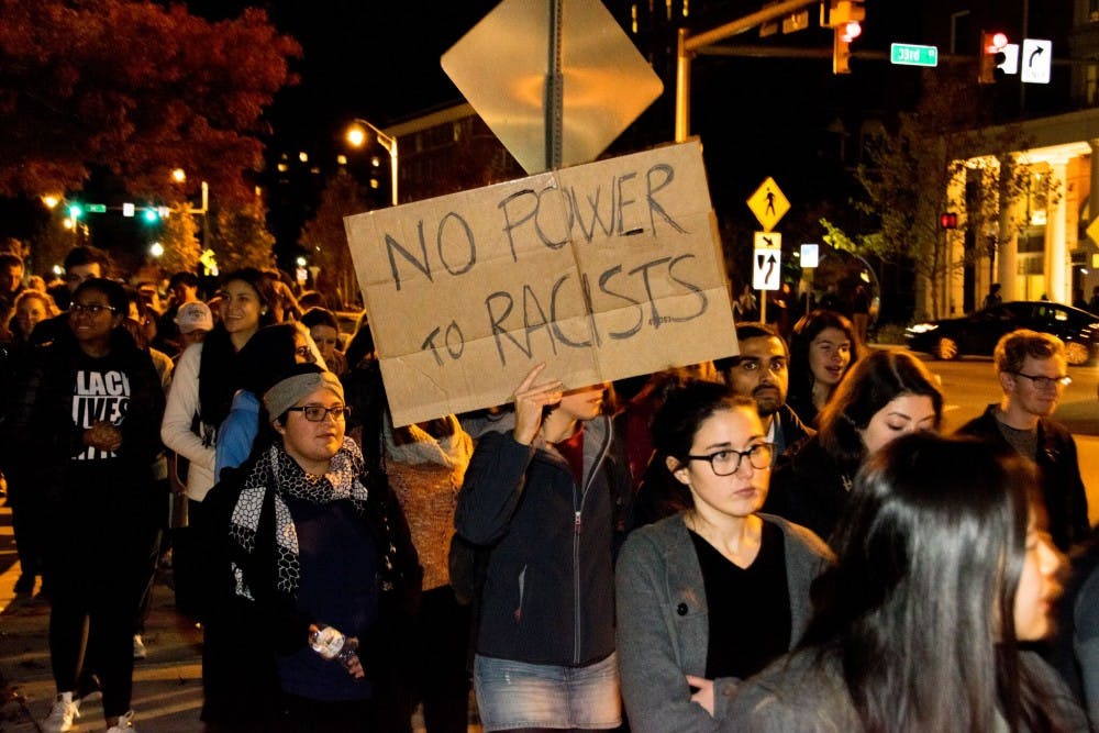 KAREEM OSMAN/PHOTOGRAPHY EDITOR
Students marched down N. Charles Street toward the Y Not Lot, holding signs and chanting slogans.