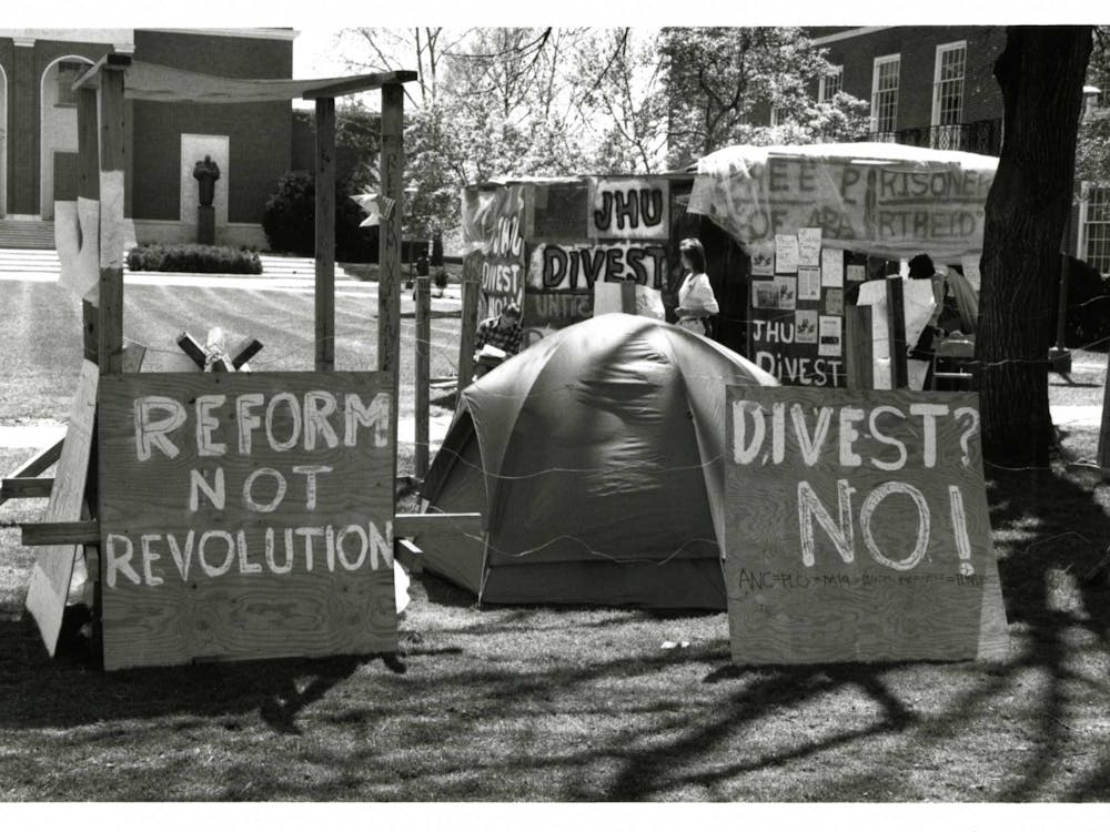 COURTESY OF THE UNIVERSITY ARCHIVES — SHERIDAN LIBRARIES
Students protest against apartheid in South Africa in 1986, when Iosso wrote for The News-Letter.